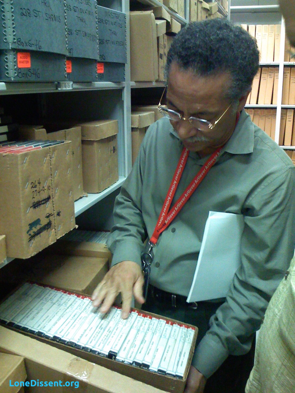 Charles DeArman, retired NARA archivist, holding a box of U.S. Supreme Court master tapes (July 2007)